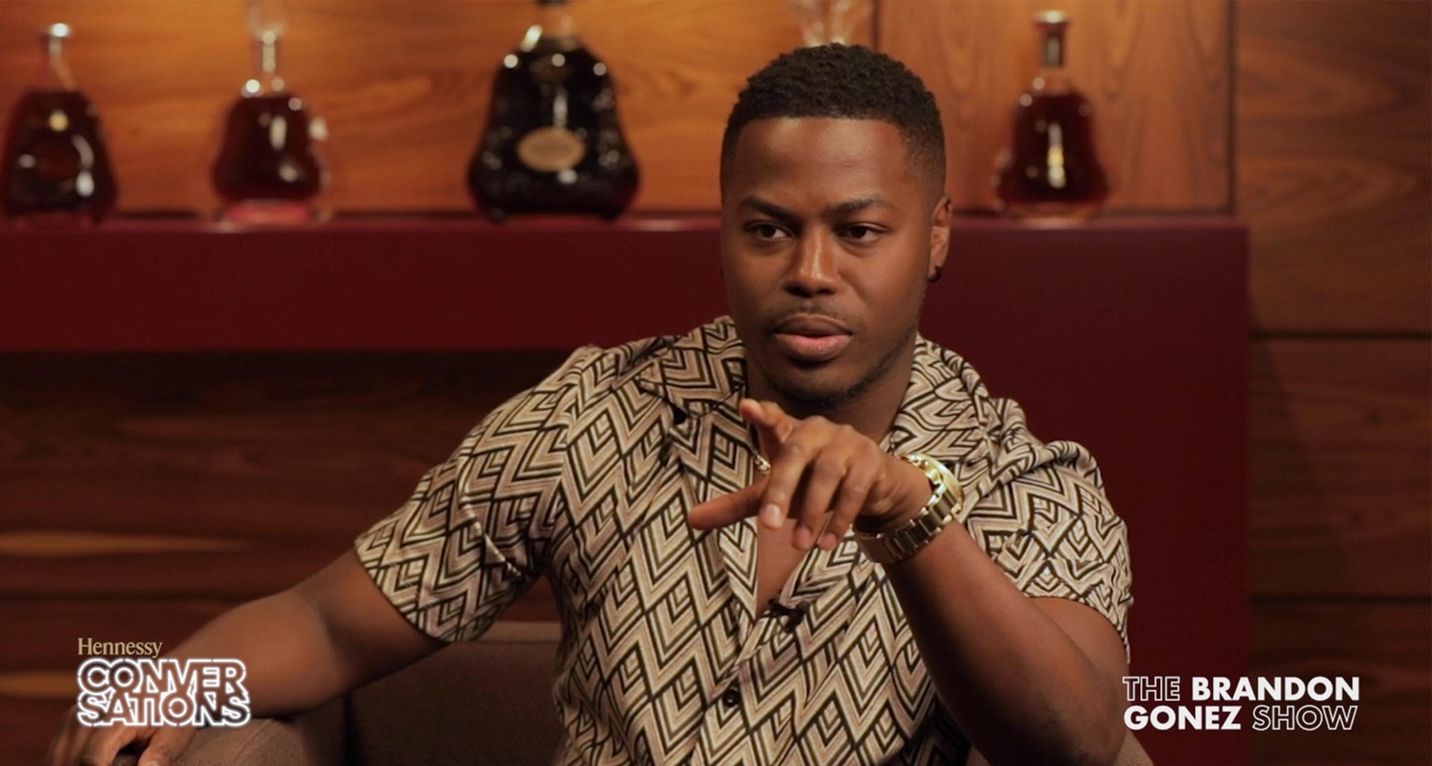 Brandon Gonez with Hennessy decanters in the background