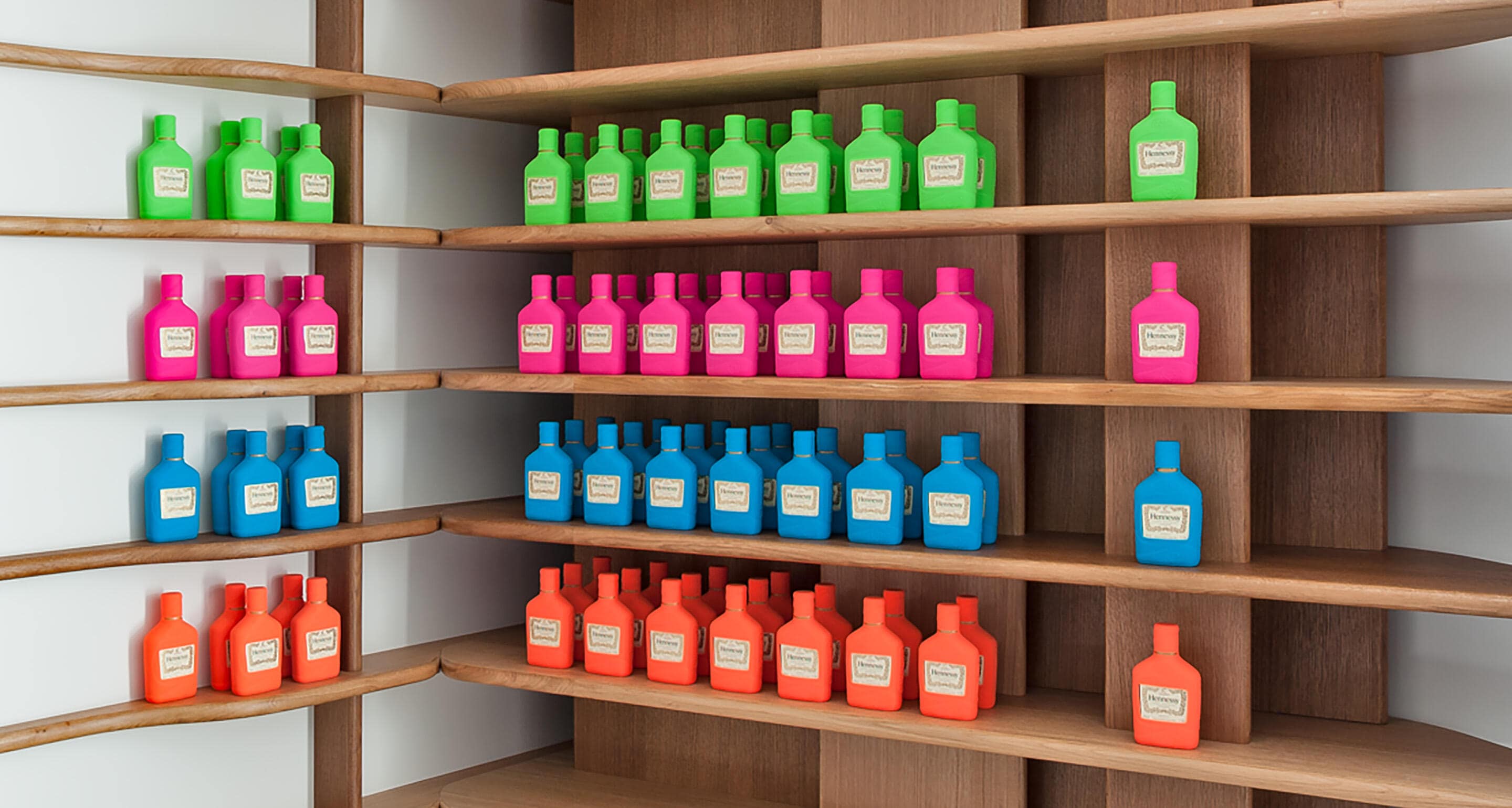 View of multicoloured Hennessy flasks on shelves, in the Hennessy Cognac store