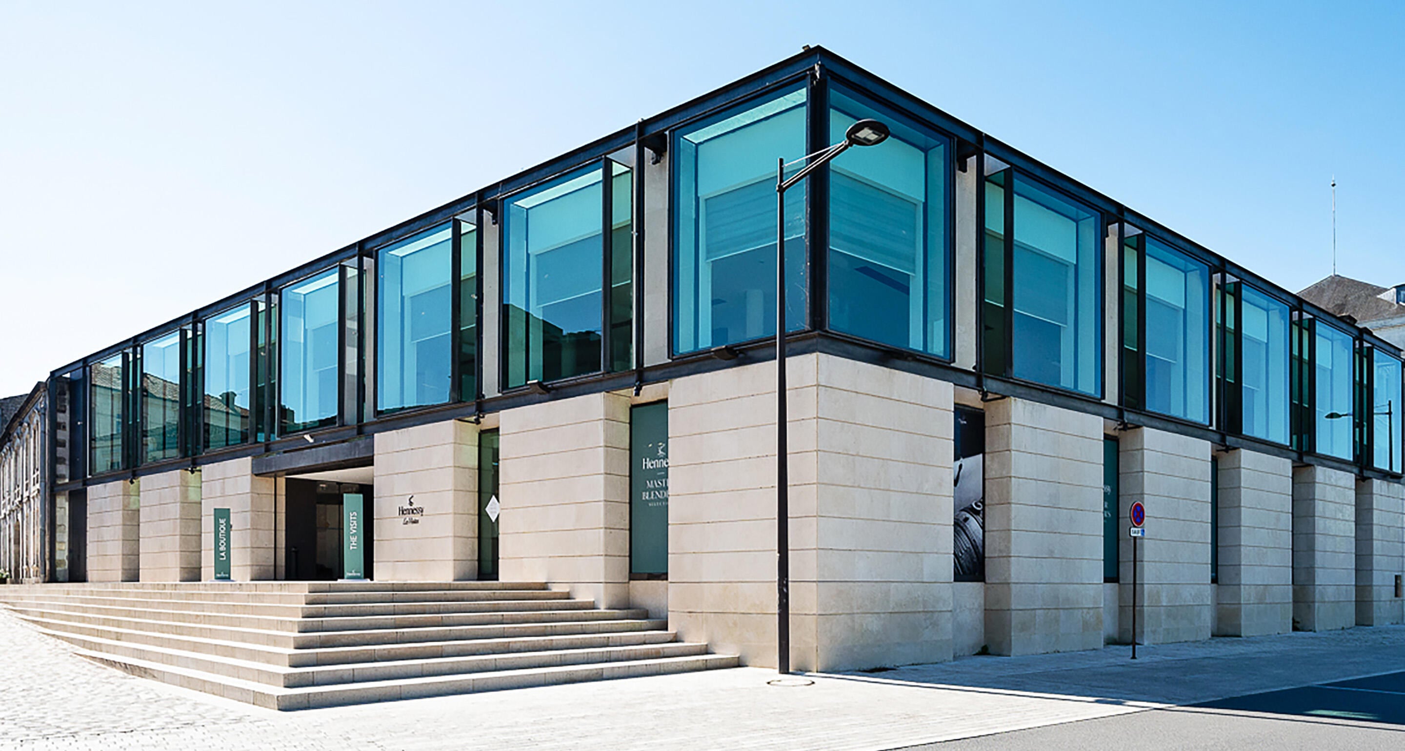 Outside view of the Hennessy Cognac boutique building, all glass and white stone, designed by French architect Jean-Michel Wilmotte