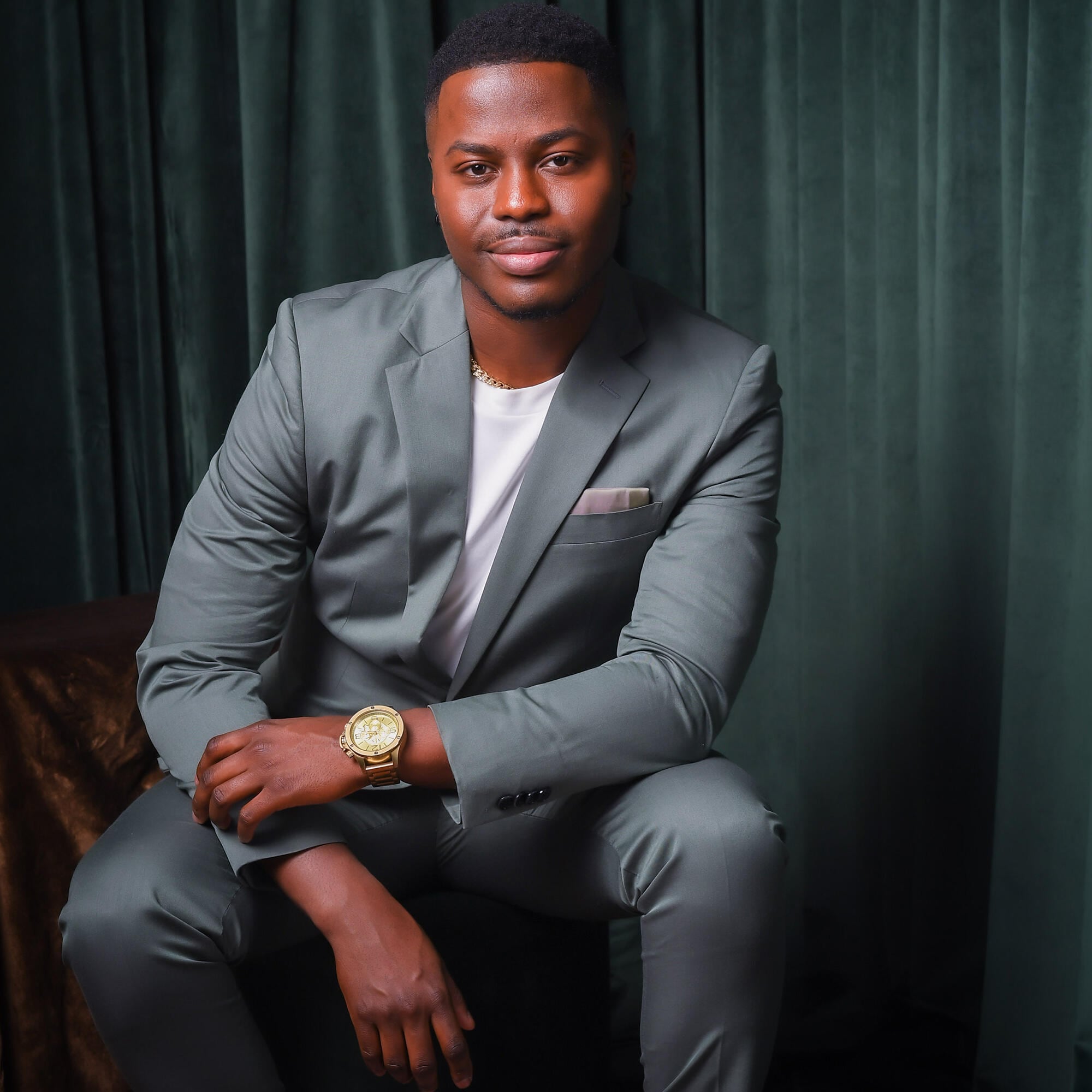 Brandon Gonez in front of the camera with a gold watch