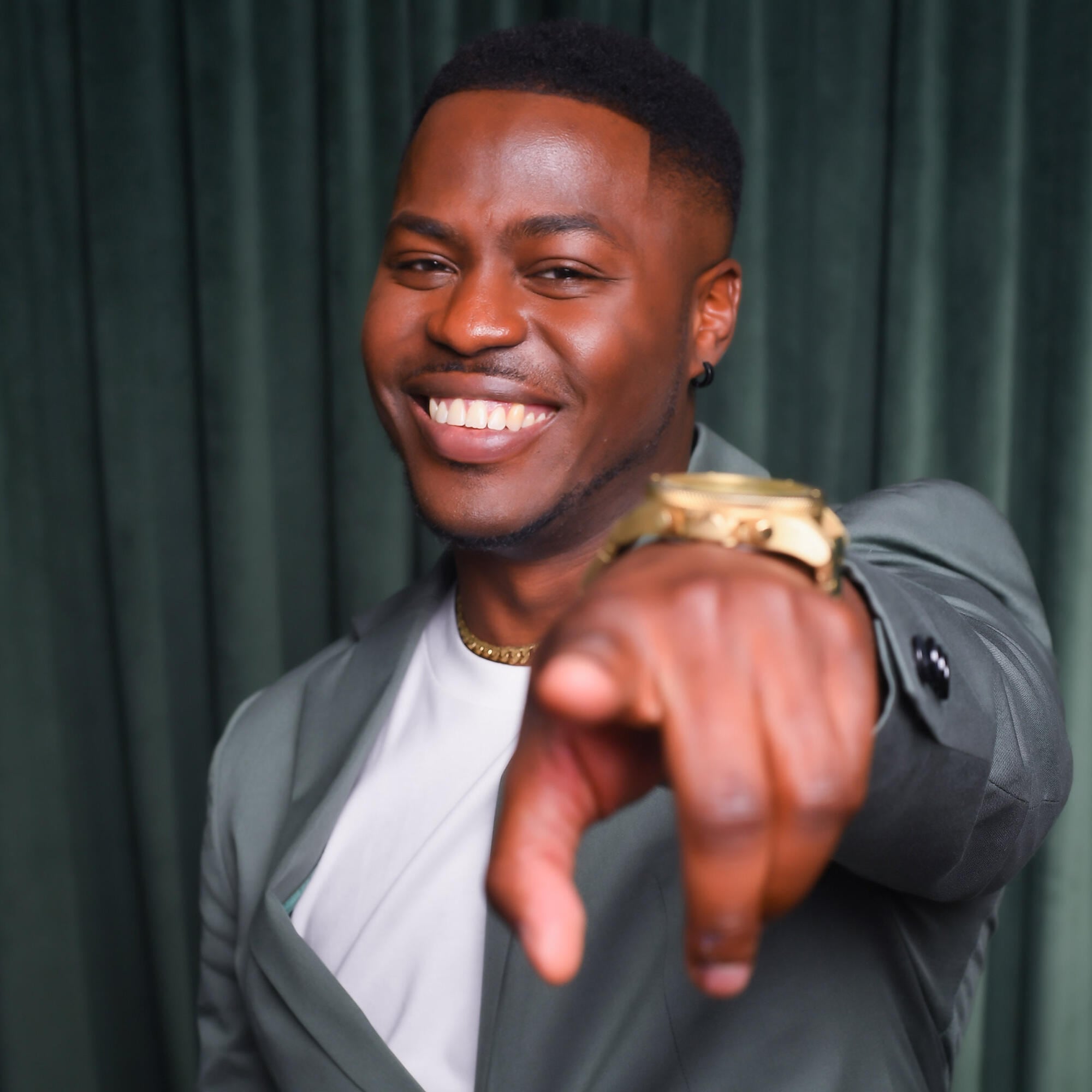 Brandon Gonez in front of the camera with a gold watch